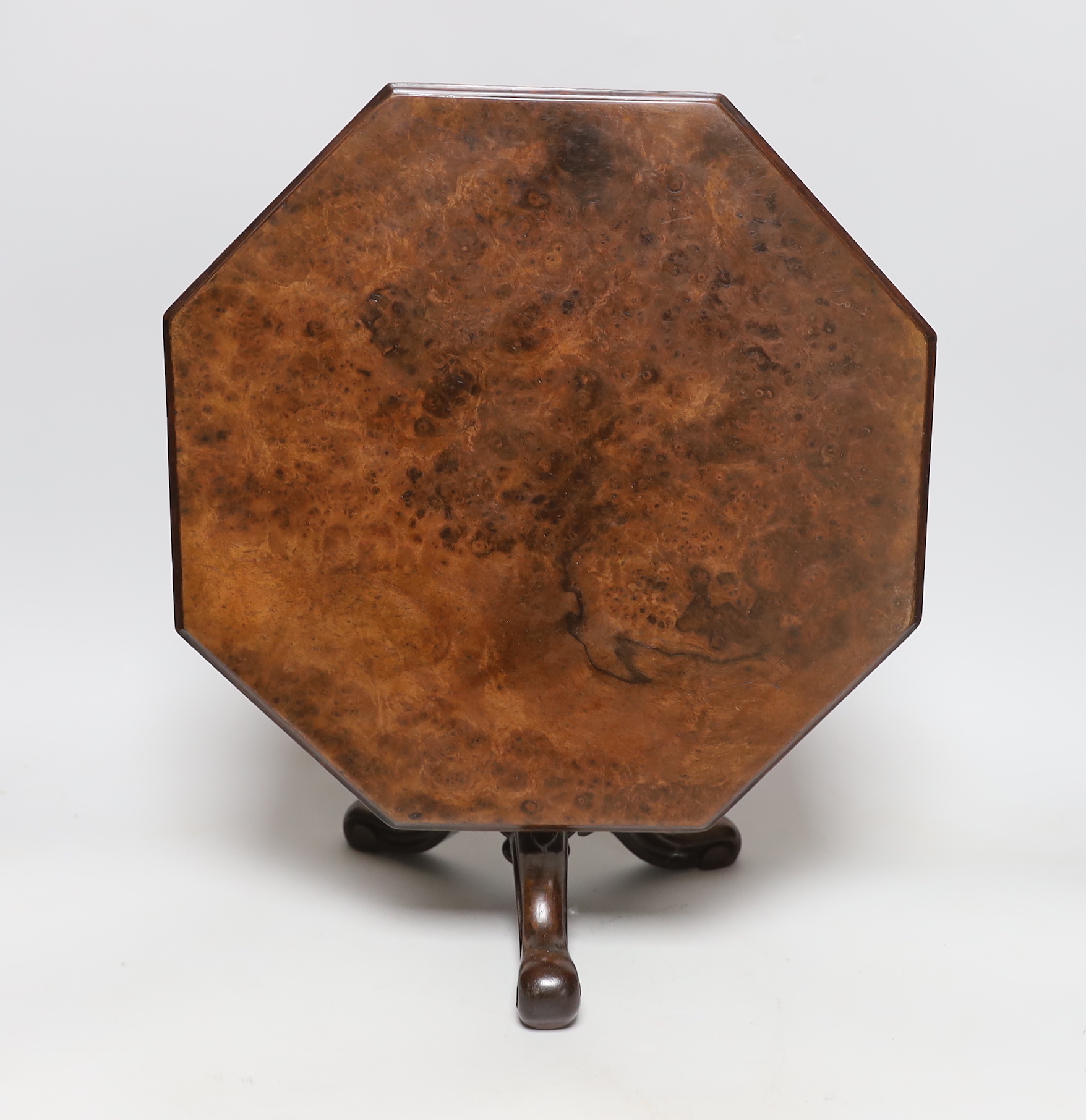 An octagonal topped burr walnut miniature tripod table, 32cm across
